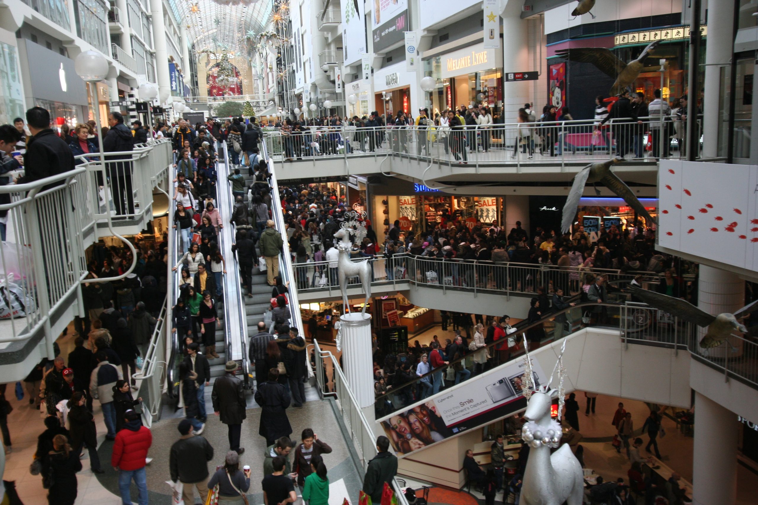 A photo of a multi-level shopping mall with lots of people