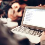 Photograph over the shoulder of a person looking at a browser