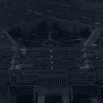 A dark, black and white aerial view of the Pentagon
