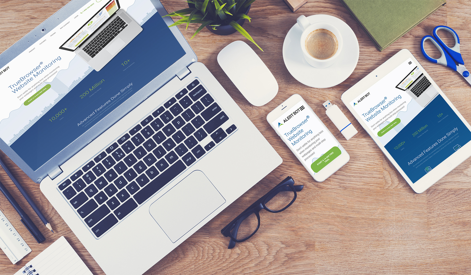 A photo showing a top-down view of a laptop and its screen, a computer mouse, cell phone, and tablet. All of the screens show the AlertBot.com website. A cup of hot coffee is also on the desk with other office items.