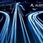 A photo showing blurred lights for traffic moving super fast on three different pathways.