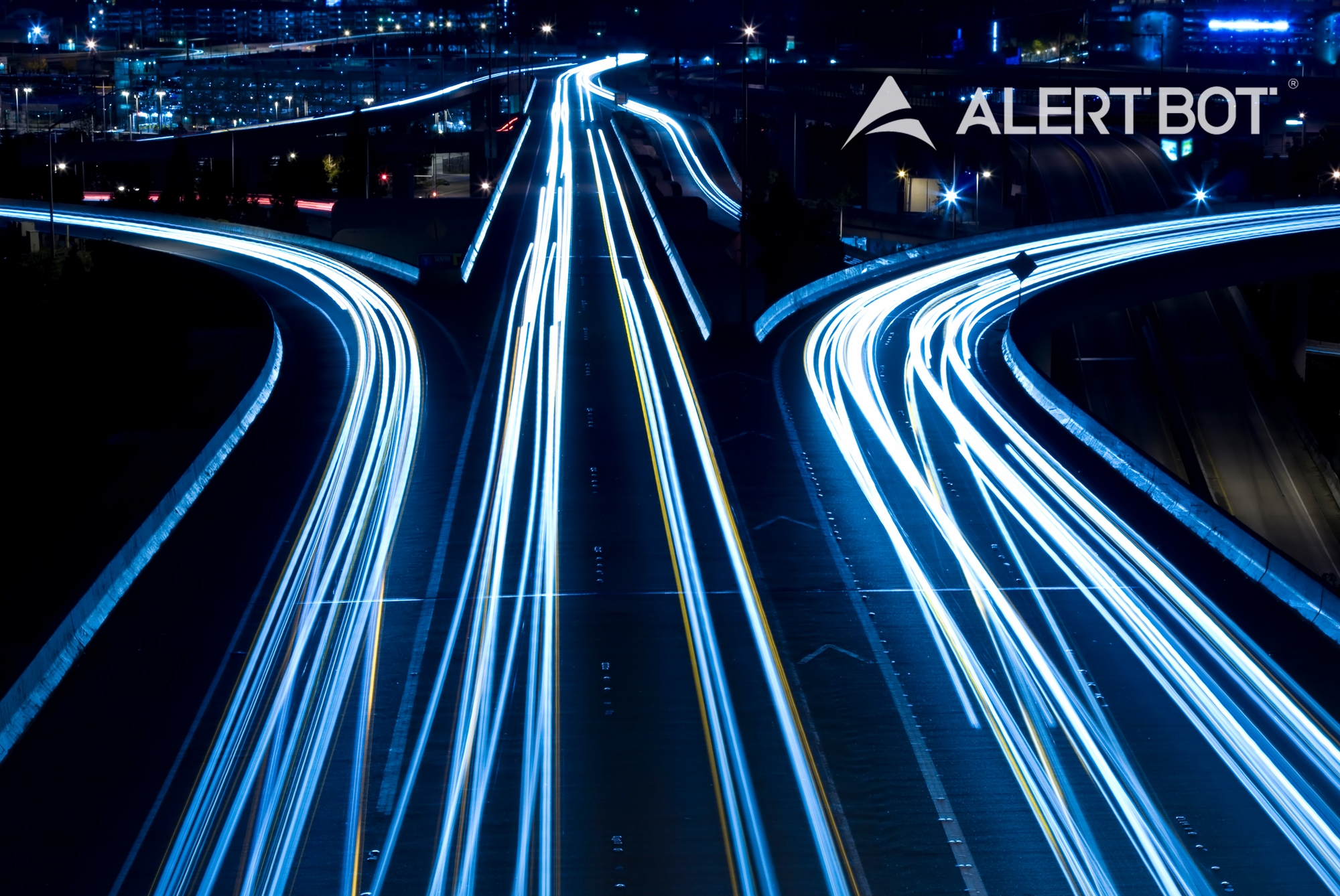 A photo showing blurred lights for traffic moving super fast on three different pathways.