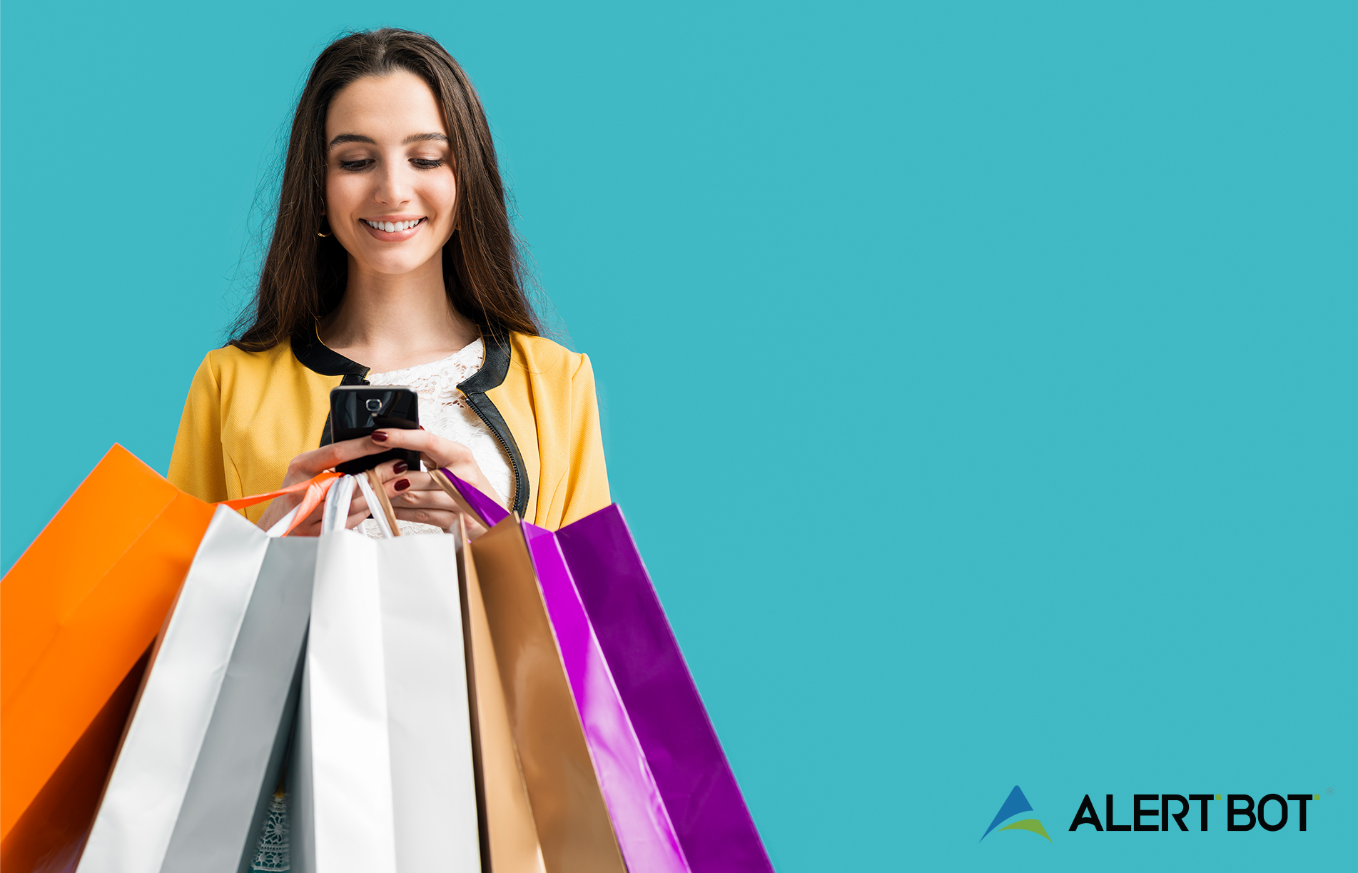 A beautiful woman with brow n hair holding and looking at her cellphone, with five shopping bags also in her hands. Text on the image reads "6 Tips to Prepare Your E-Commerce Site for the Biggest Holiday Traffic Surge Ever"