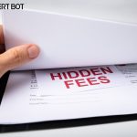 Blog title of "Warning: 3 Reasons Why You Shouldn&rsquo;t Pay a &ldquo;Setup Fee&rdquo; When Buying a Website Uptime Monitoring Solution" with photo of a man's hand lifting up a paper to reveal a small slip of paper between pages that reads "Hidden Fees."